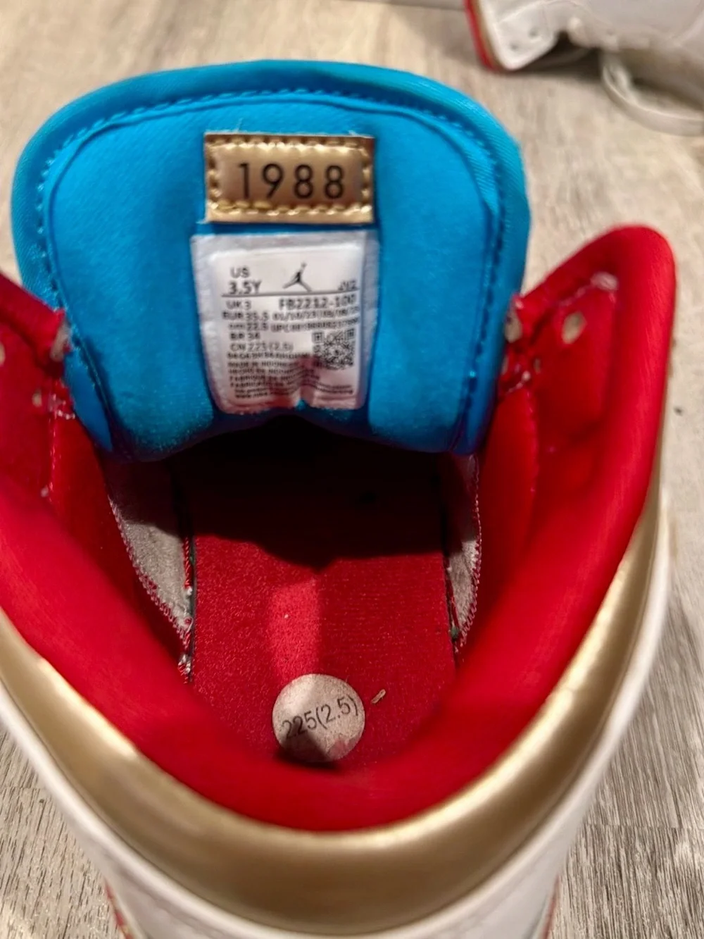 Jordan Kids White High-Top Sneakers with Gold, Teal & Red Accents